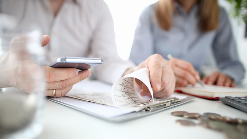 A family budgeting using a smartphone app.