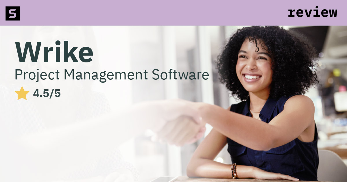 Woman reviewing Wrike.