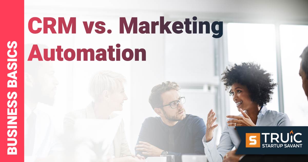 Business people working around a laptop.