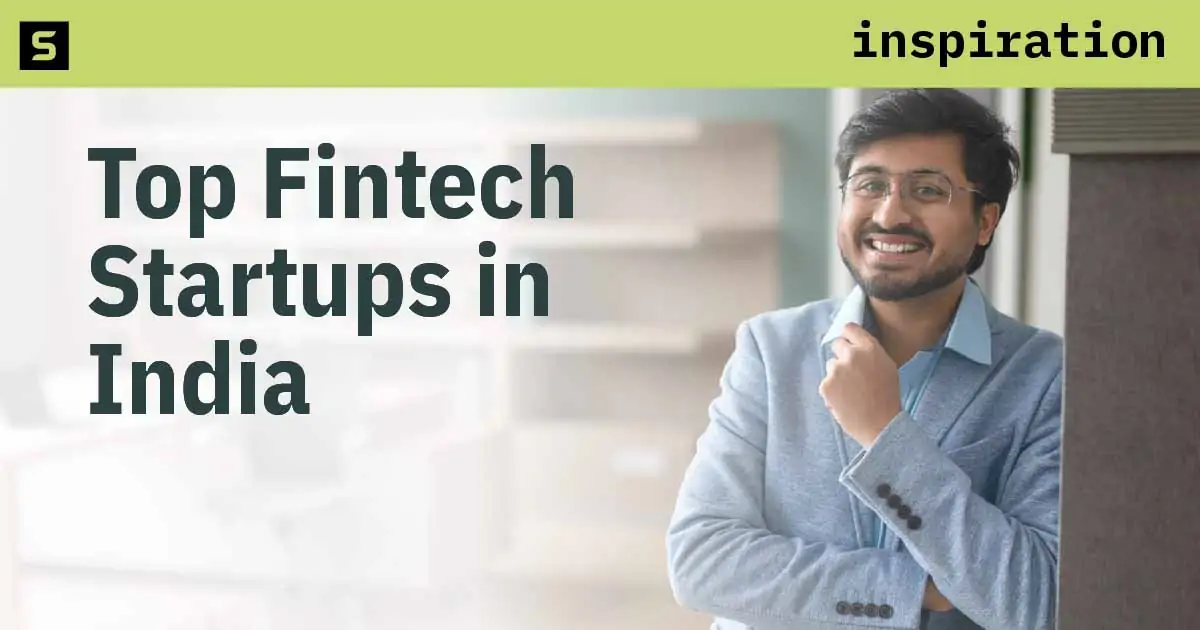 Man in India looking at the top fintech startups on a tablet.