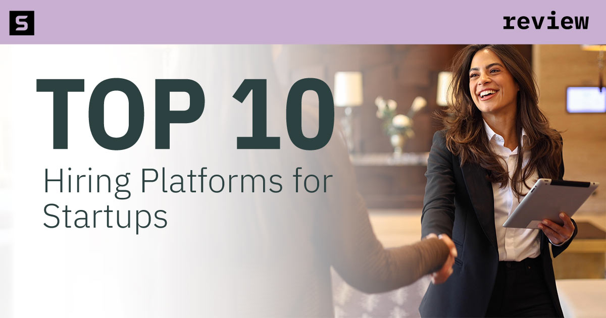 Smiling businesswoman shaking hands with businessman.