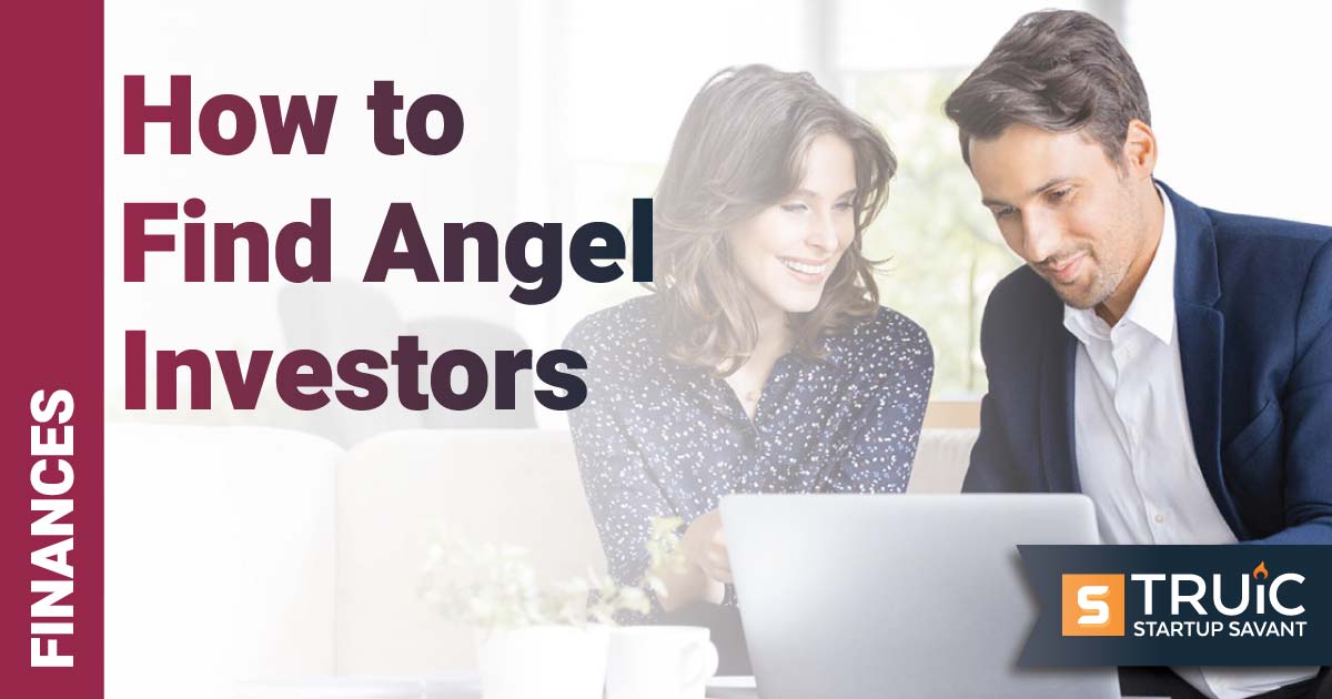 Two people looking at a laptop.