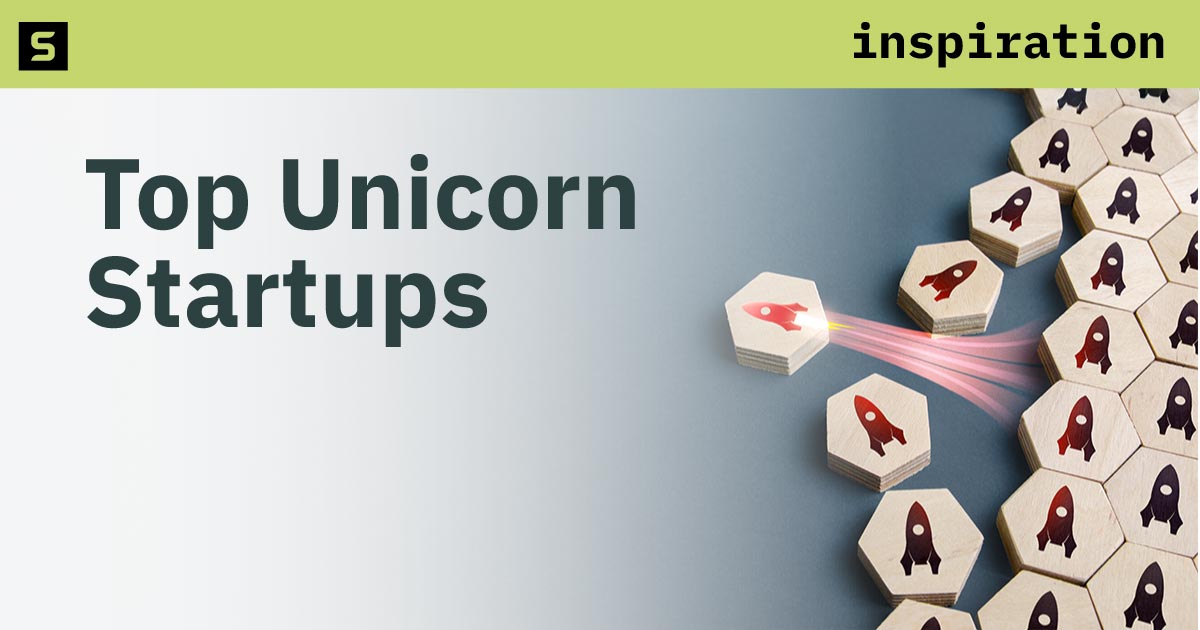 A group of rocketships with one blasting away from the group.